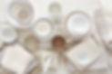 white plates and bowls on wooden table